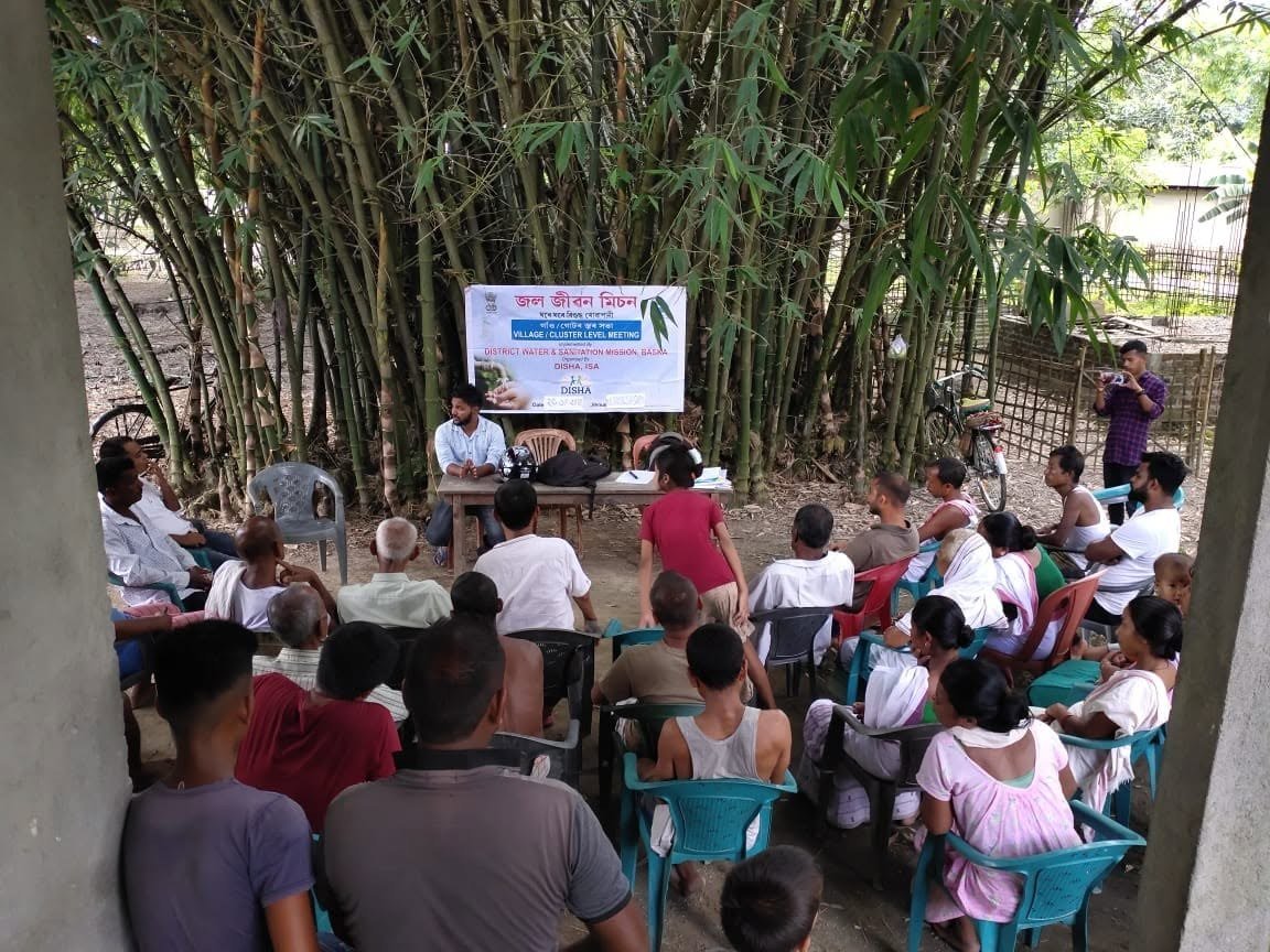 Community meeting in a village setting